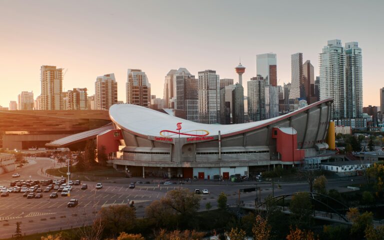 Calgary skyline and Scotiabank Saddledome at sunset.