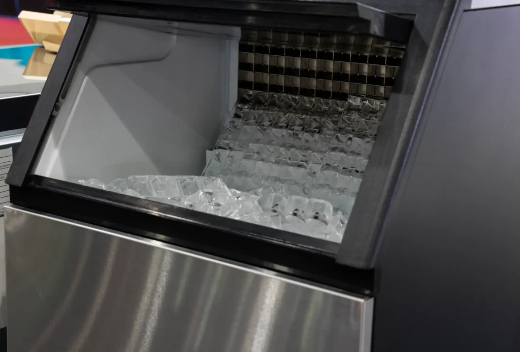 Commercial ice maker filled with ice cubes