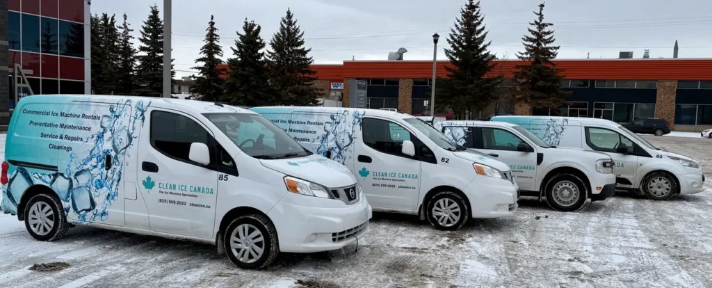 Four Clean Ice Canada service vans in snowy lot